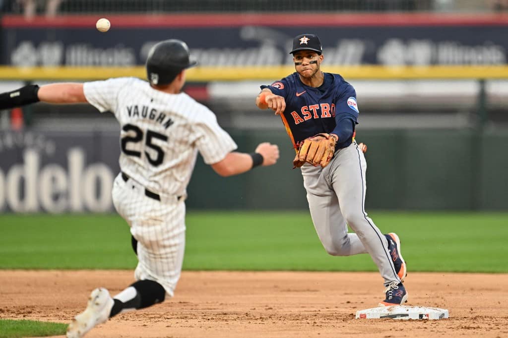 Houston Astros throws to first base